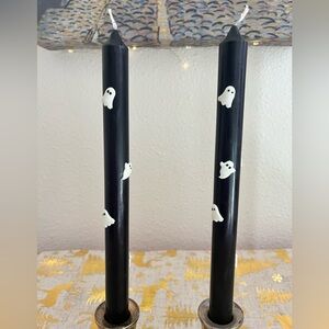 A set of two Halloween glow in the dark ghost candles